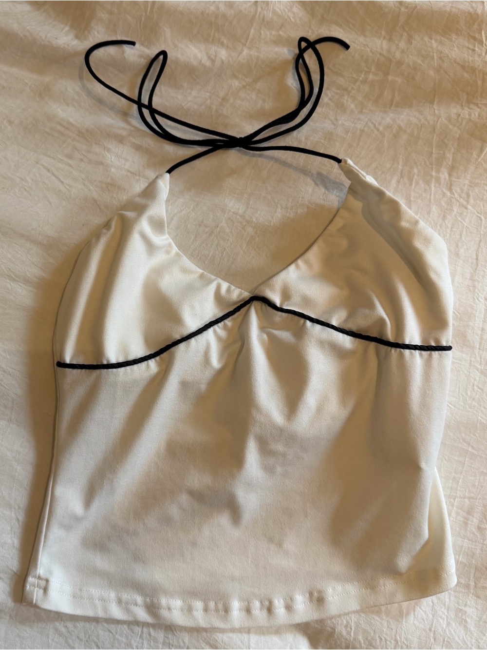 White halter neck crop top with black trim